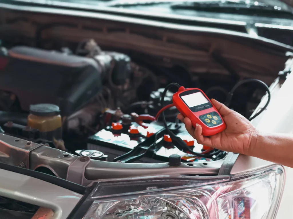 A professional performs a pre-purchase car inspection in Easton Commons, checking the car's electronics.