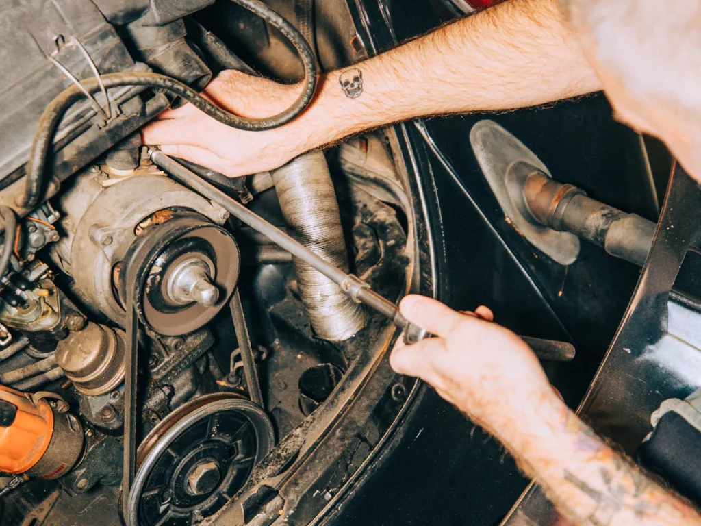 A thorough engine inspection for Westbranch vehicle inspection services, focusing on the drive belts.