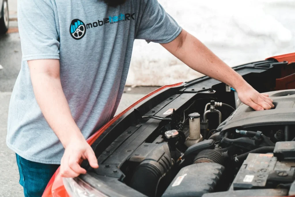 Mechanic performing a thorough vehicle check. Book your Certified Car Inspection Houston today.
