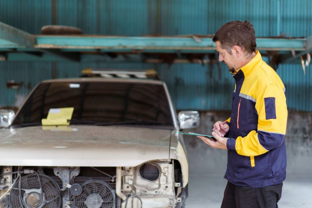 Pre-purchase car inspection expert reviewing a checklist. Discover the best car inspection service Houston offers today!