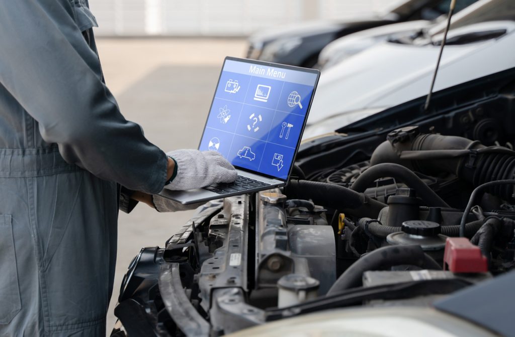 Advanced computer diagnostics during a premium check used car service Houston to identify hidden engine issues.