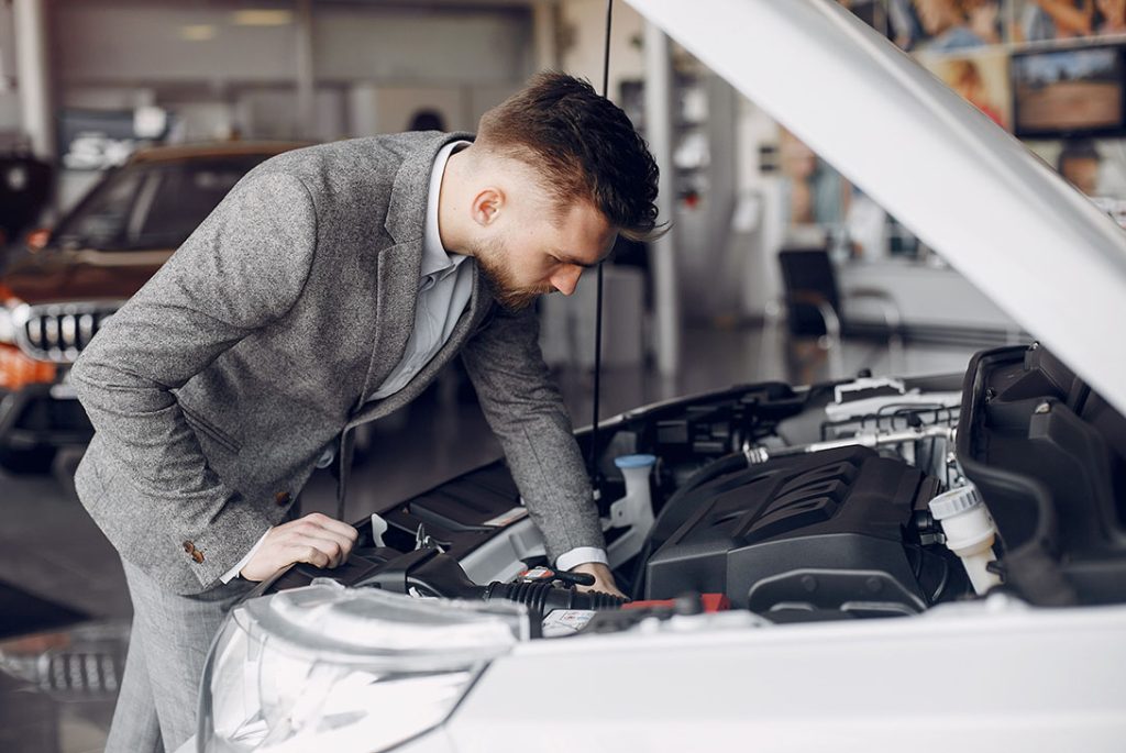 Professional advisor performing a third party inspection Houston car buyers trust to check engine health and safety.